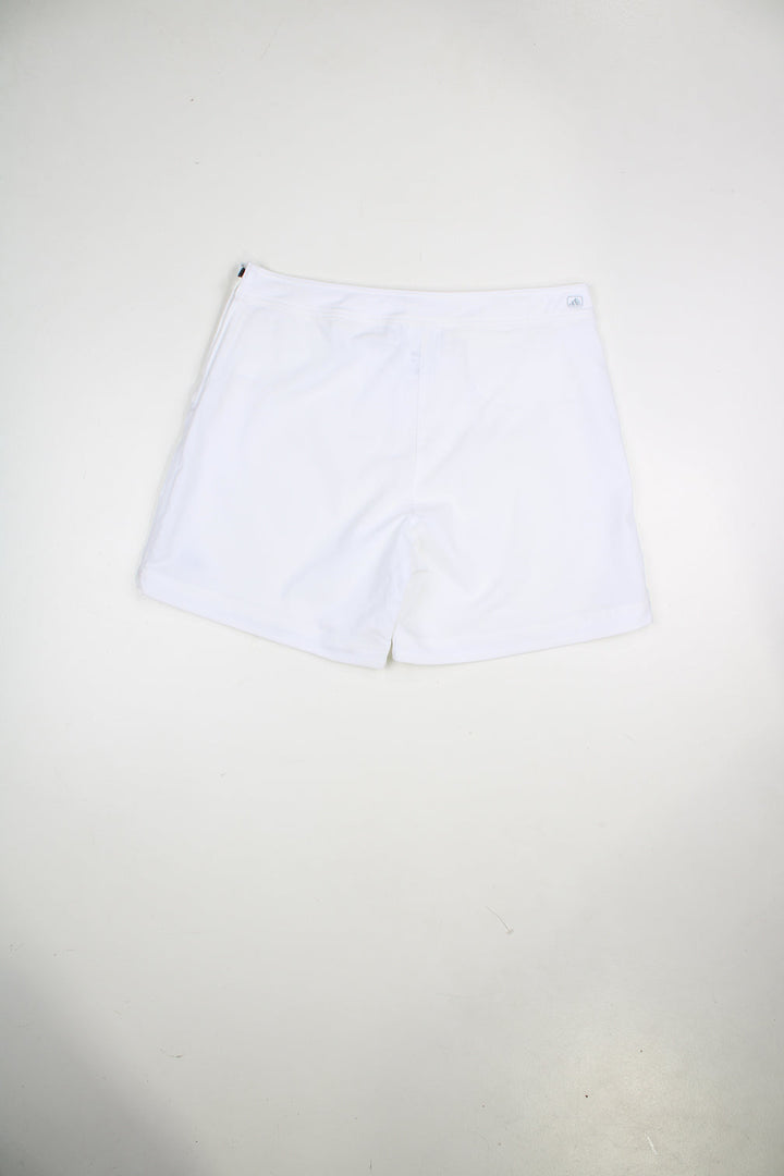 Vintage Adidas white shorts with embroidered logo and zip fastening.