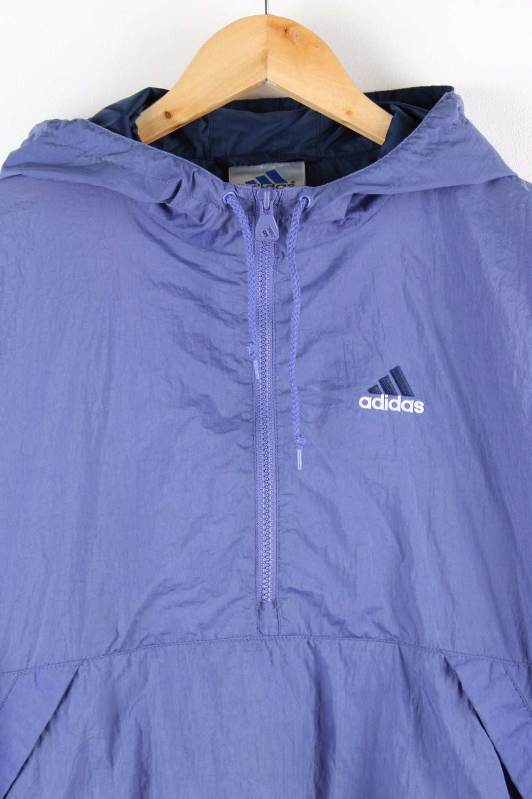 Vintage Adidas pullover tracksuit top in purple with half zip. Features embroidered logo on the chest.