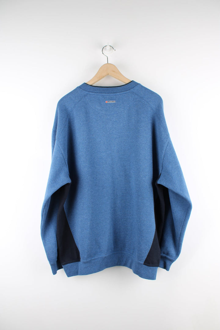 Vintage Ellesse blue sweatshirt with embroidered logo on the chest.