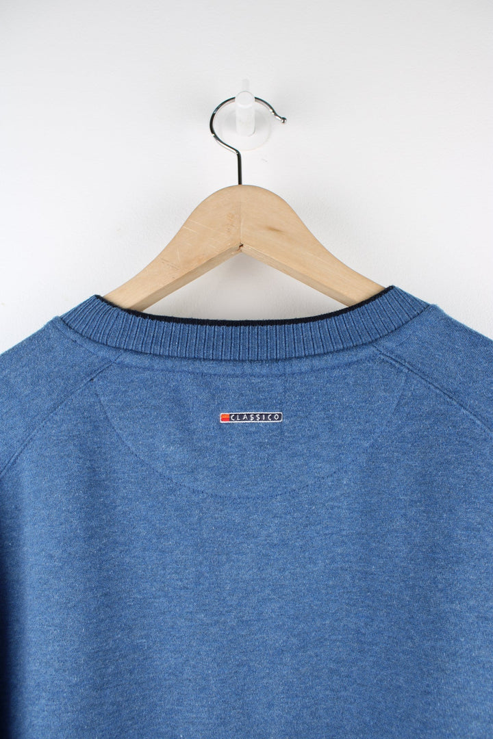 Vintage Ellesse blue sweatshirt with embroidered logo on the chest.