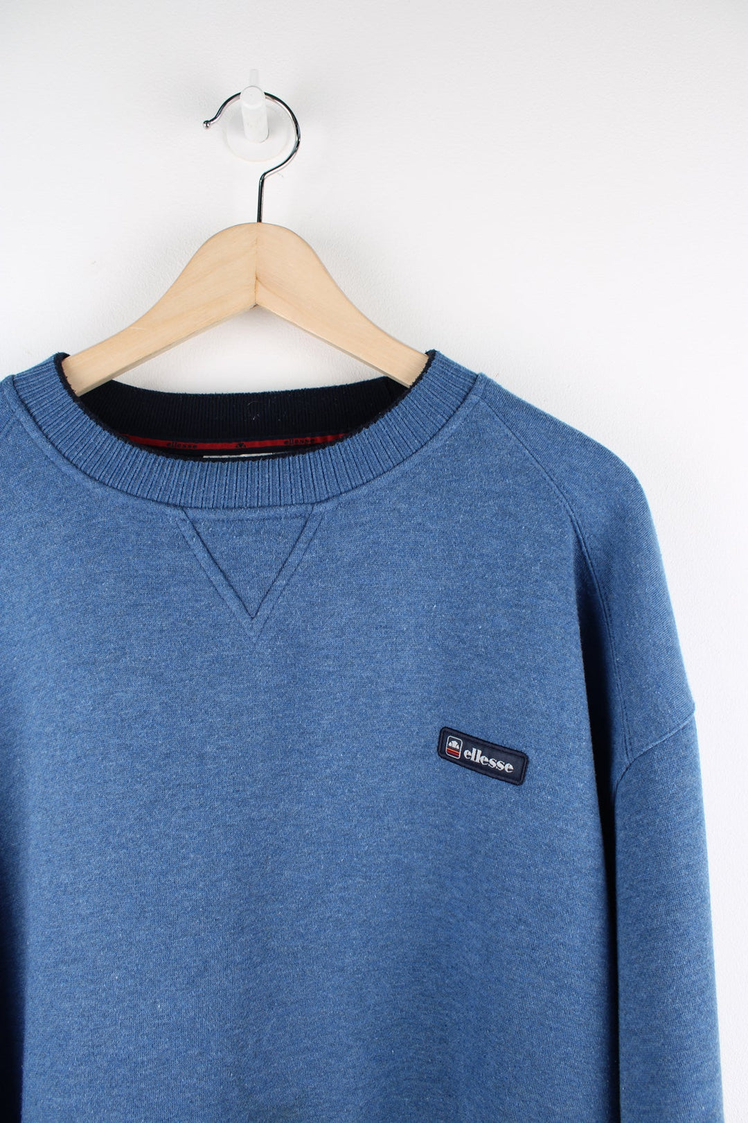 Vintage Ellesse blue sweatshirt with embroidered logo on the chest.