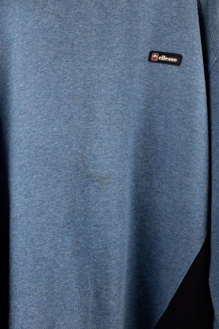 Vintage Ellesse blue sweatshirt with embroidered logo on the chest.