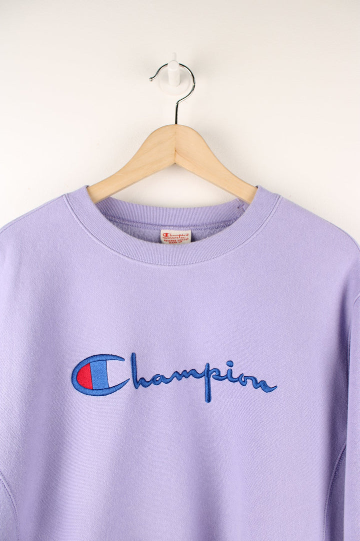 Purple Champion Reverse Weave sweatshirt with embroidered logo across the chest.