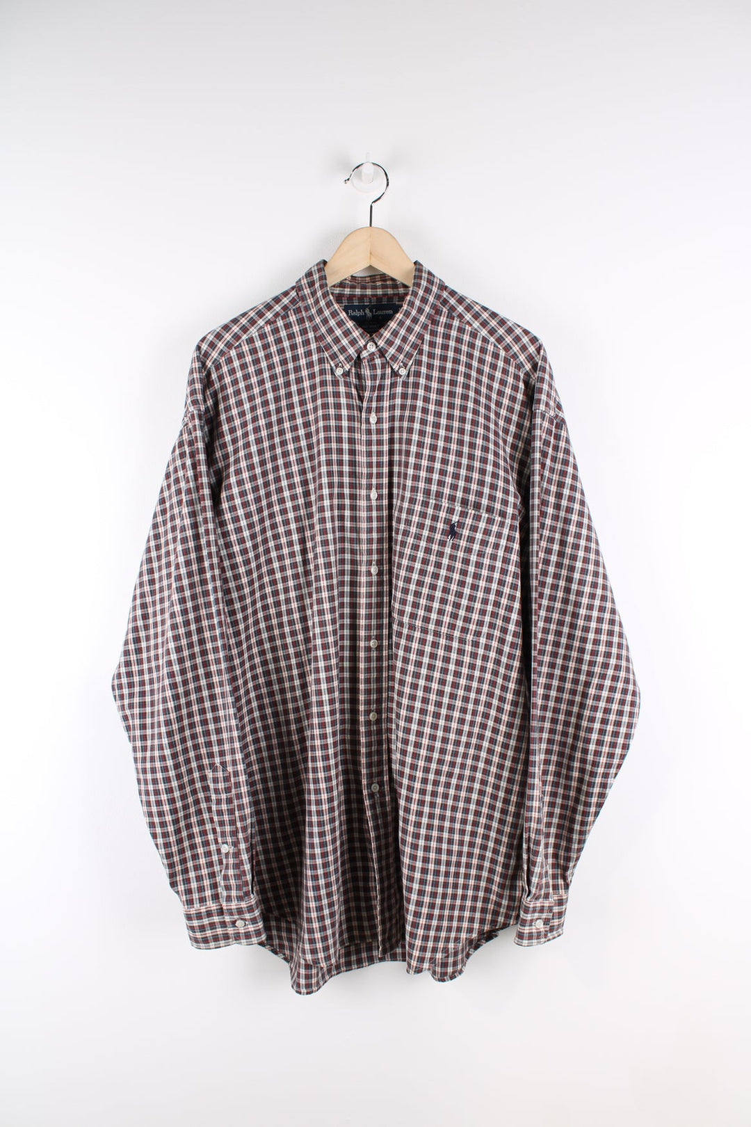 Ralph Lauren check button up shirt featuring signature embroidered logo and pocket on the chest.