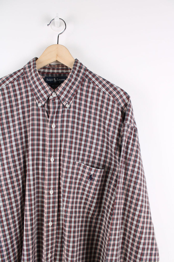 Ralph Lauren check button up shirt featuring signature embroidered logo and pocket on the chest.