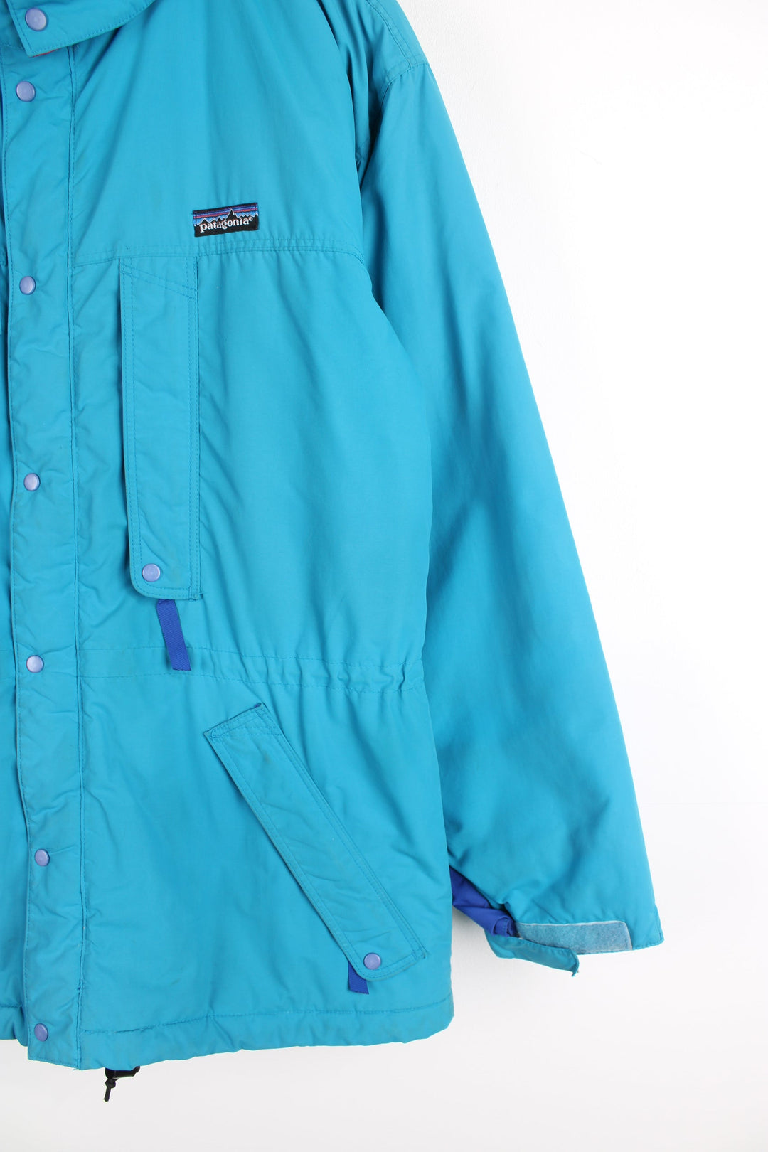 Vintage 90's Patagonia bright blue padded guide coat, features embroidered logo on the chest, mulitple pockets and removable hood