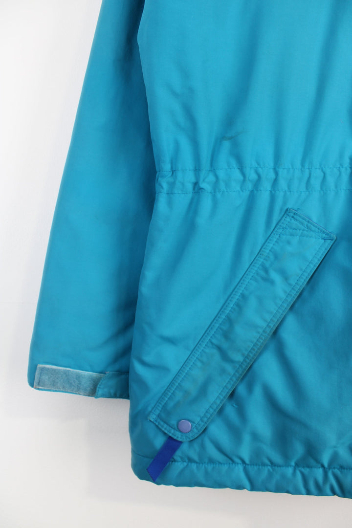 Vintage 90's Patagonia bright blue padded guide coat, features embroidered logo on the chest, mulitple pockets and removable hood