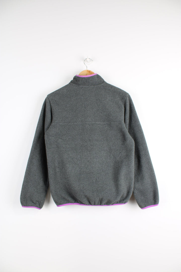 Patagonia Synchilla fleece in grey features snap t closure and embroidered logo on the chest 