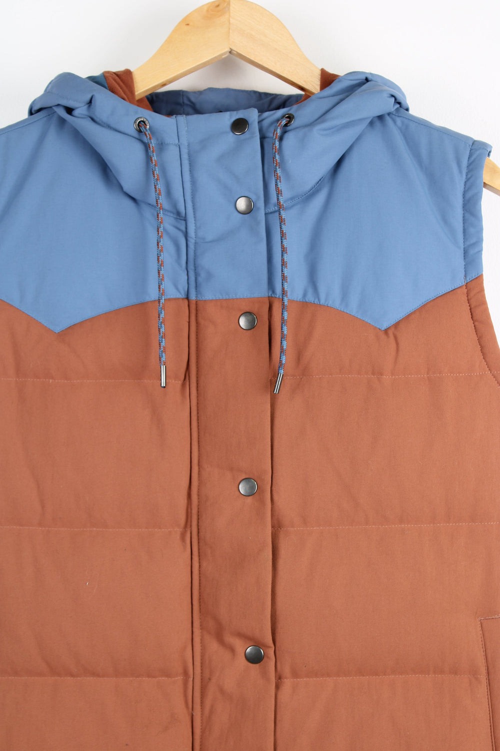 Patagonia Bivy hooded, button up pufffer gilet features pockets and embroidered logo on the chest 