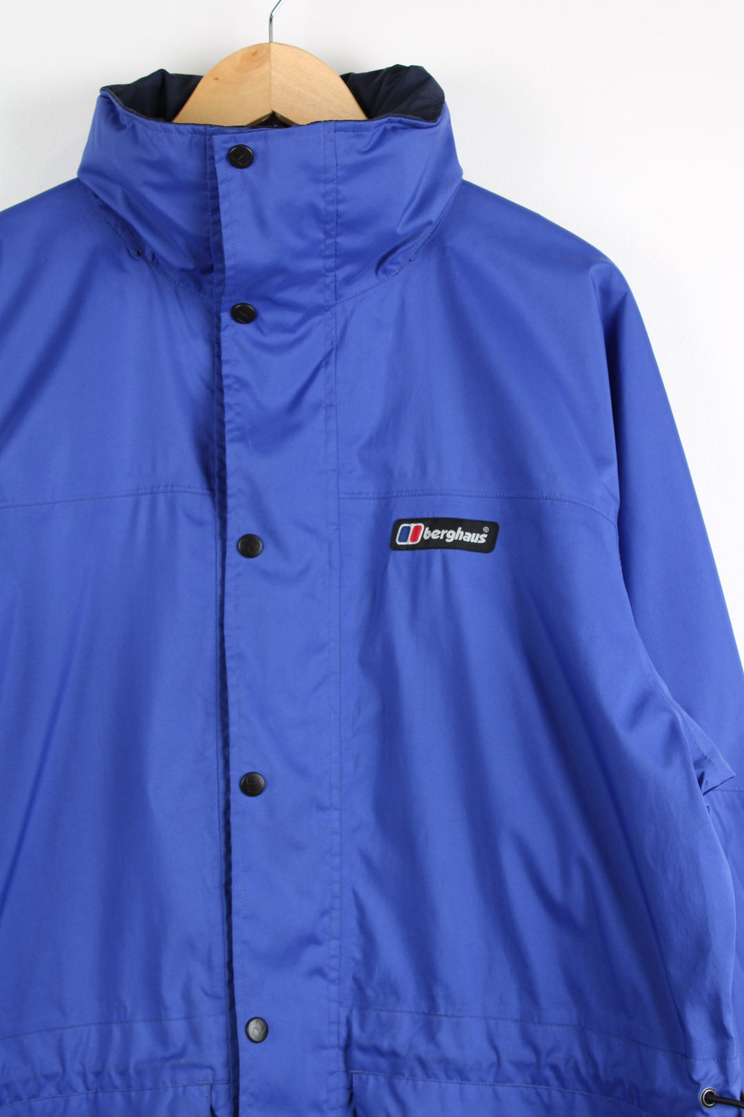 Berghaus Driaqua indigo blue zip through outdoor jacket, features multiple pockets and foldaway hood