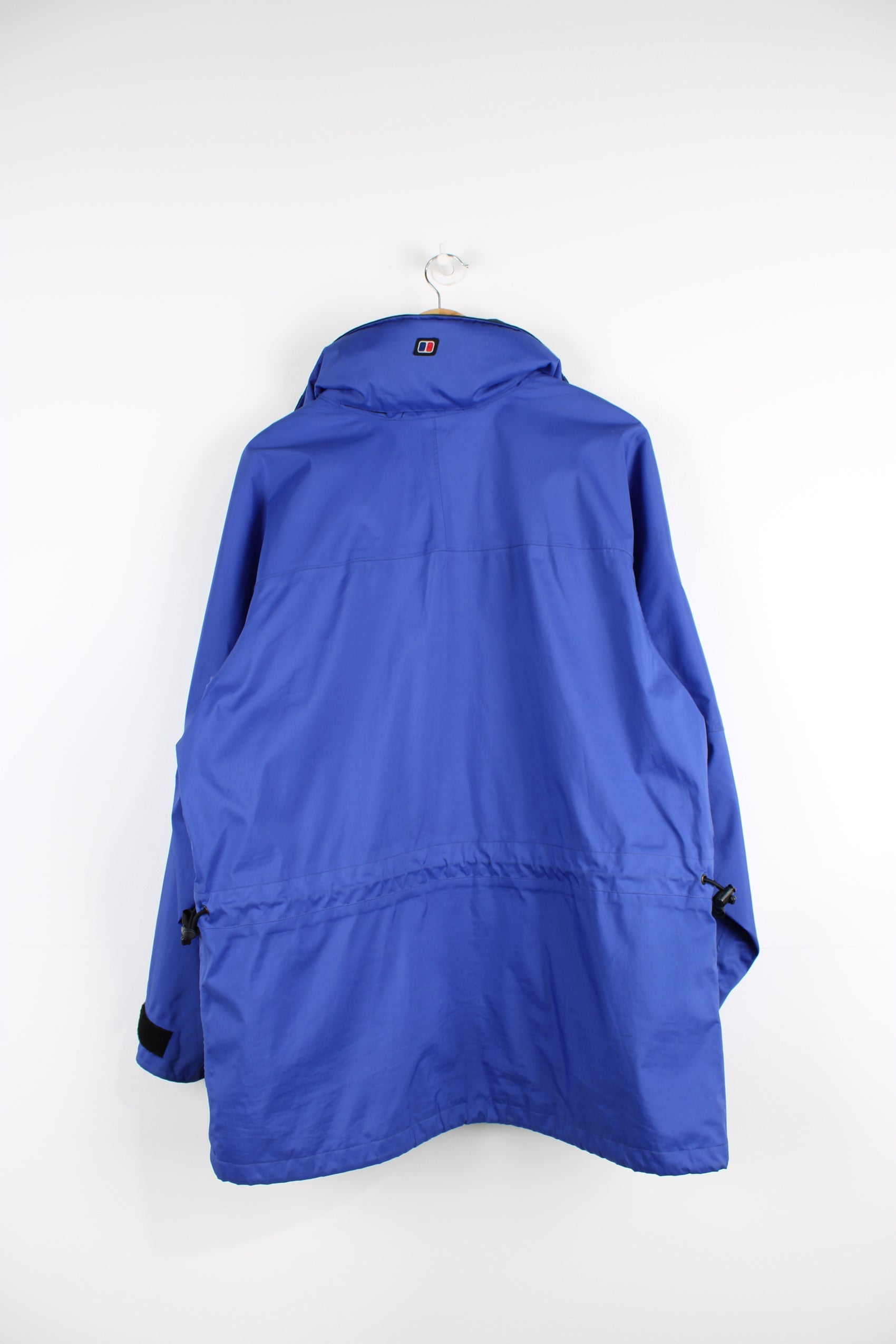 Berghaus Driaqua indigo blue zip through outdoor jacket, features multiple pockets and foldaway hood