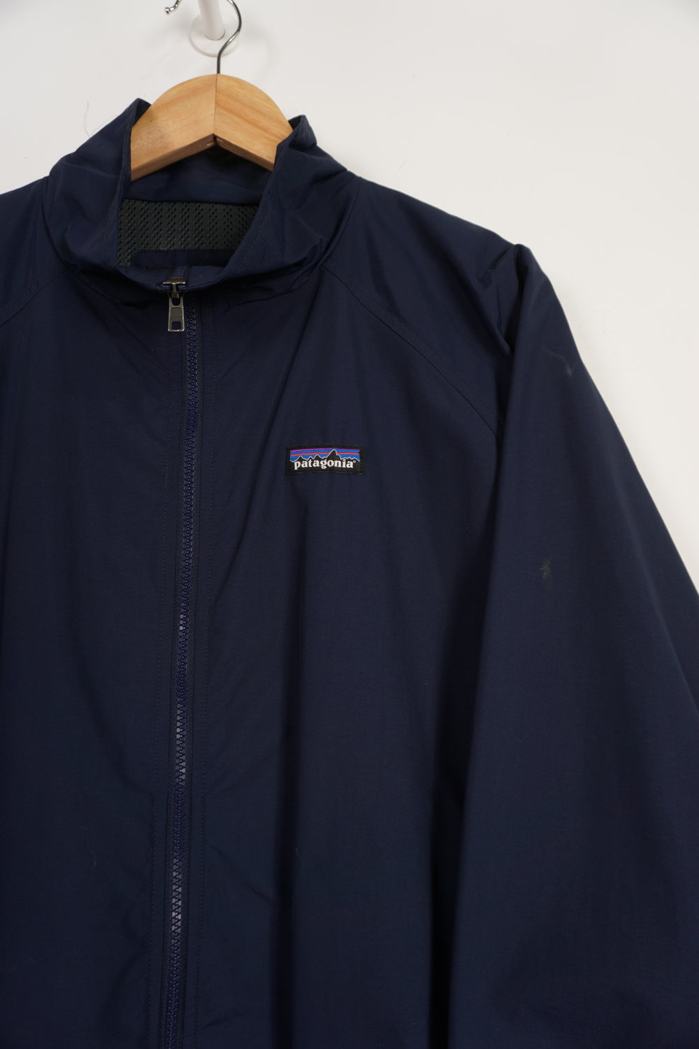 Navy blue Patagonia zip through lightweight jacket with embroidered logo on the chest