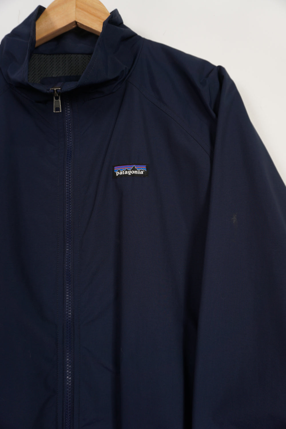 Navy blue Patagonia zip through lightweight jacket with embroidered logo on the chest