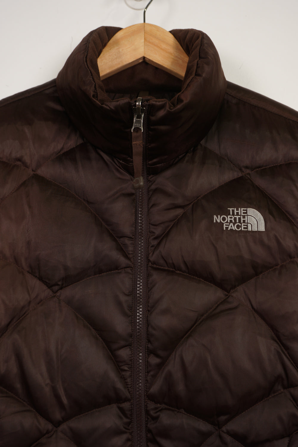 The North Face 550 brown double pocket satin gilet with embroidered logo on the front & backThe North Face 550 brown double pocket satin gilet with embroidered logo on the front & back