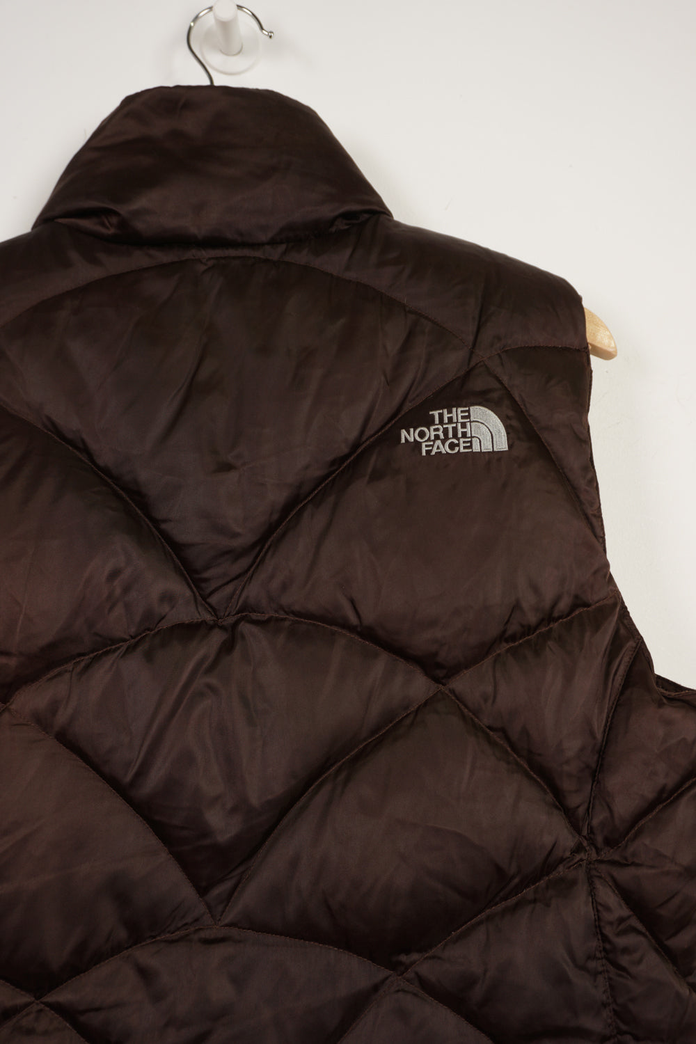 The North Face 550 brown double pocket satin gilet with embroidered logo on the front & back