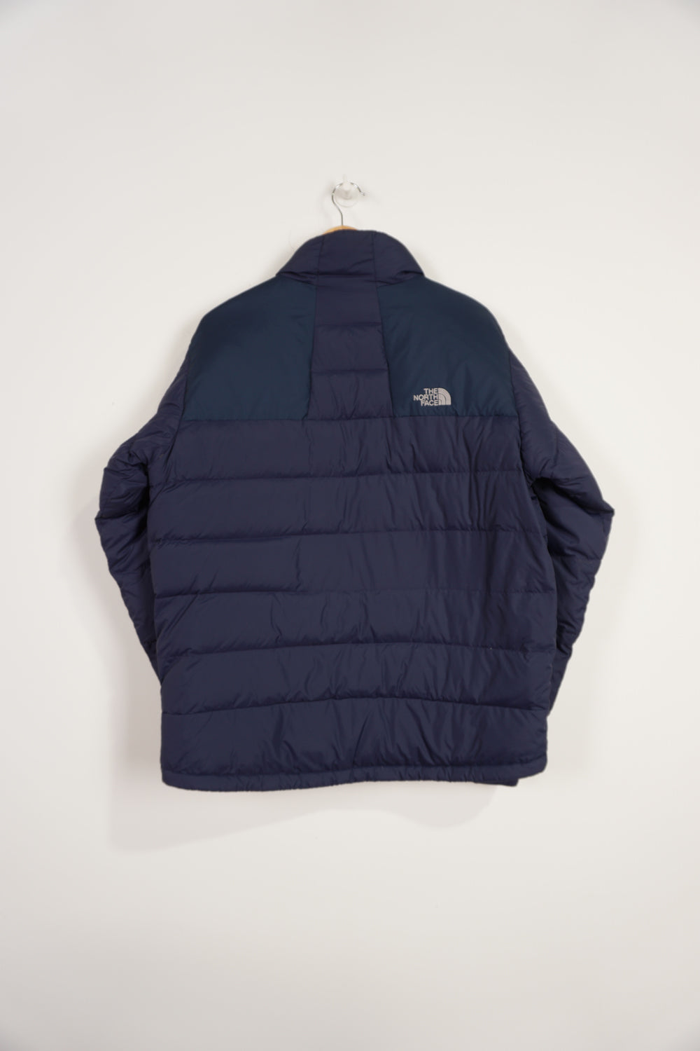 Navy blue The North Face 700 puffer jacket with embroidered logos and zip up pockets