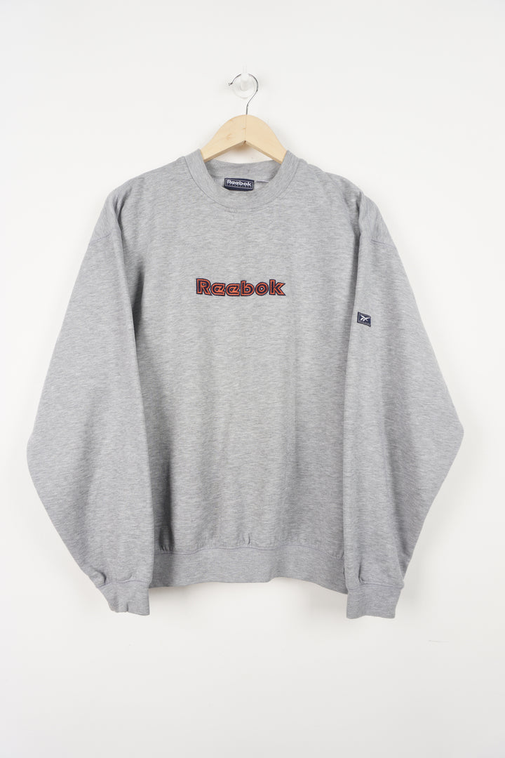 Grey Reebok crewneck sweatshirt with embroidered spell-out logo the front