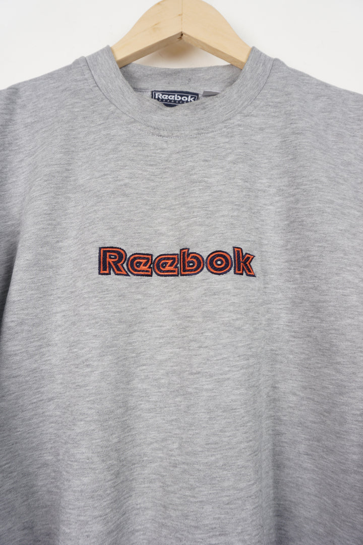 Grey Reebok crewneck sweatshirt with embroidered spell-out logo the front