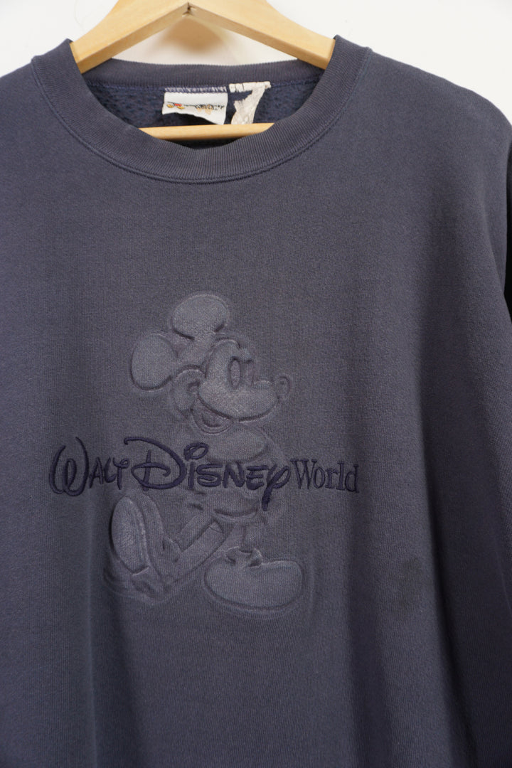 Vintage Disney faded navy blue crewneck sweatshirt with embossed Mickey Mouse and embroidered text