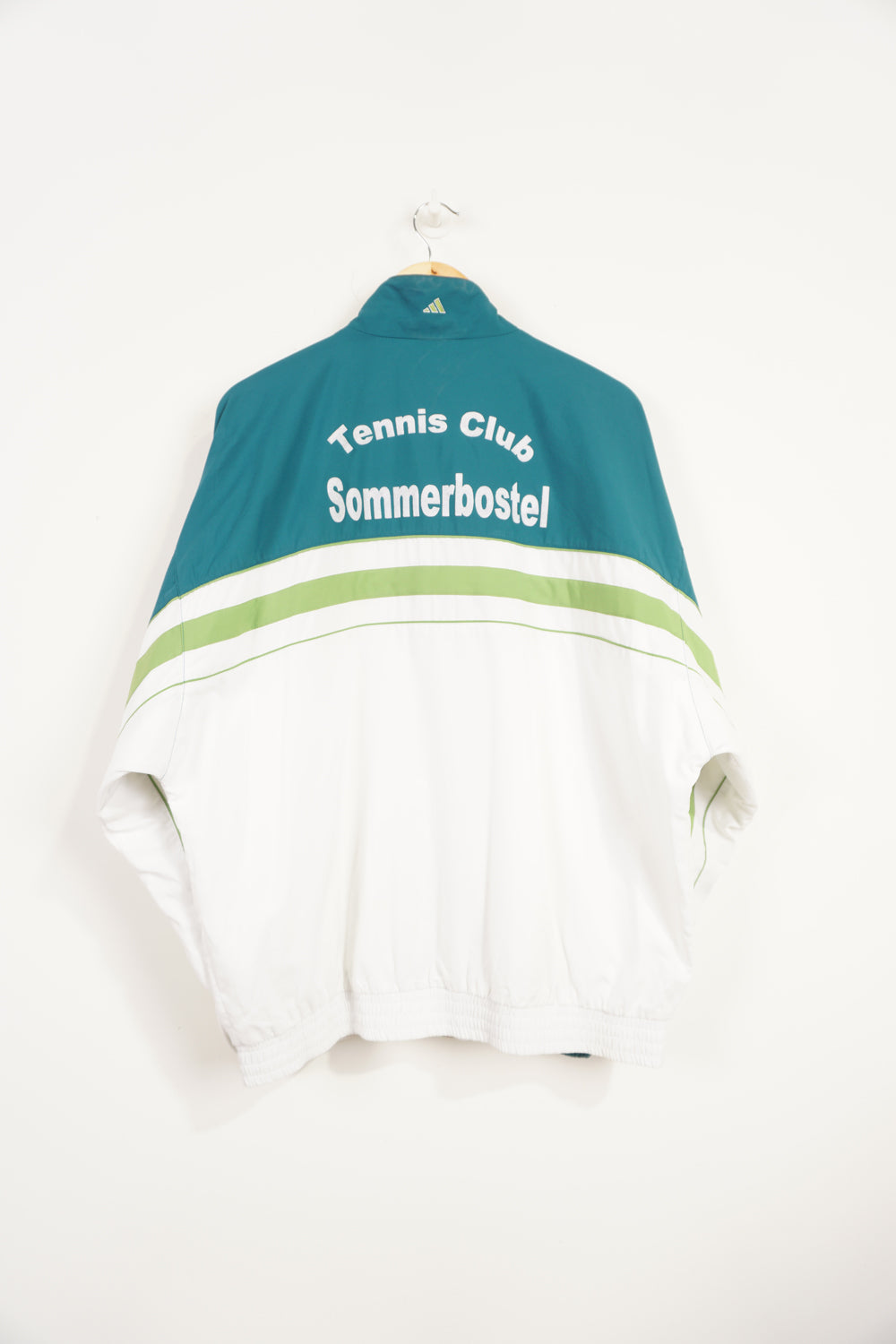 90's Teal Adidas zip through tracksuit top with green details and embroidered logo on the chest. "Tennis Club Sommerbostel" raised lettering on&nbsp;reverse good condition: slight discolouration on lettering Size in Label: L 