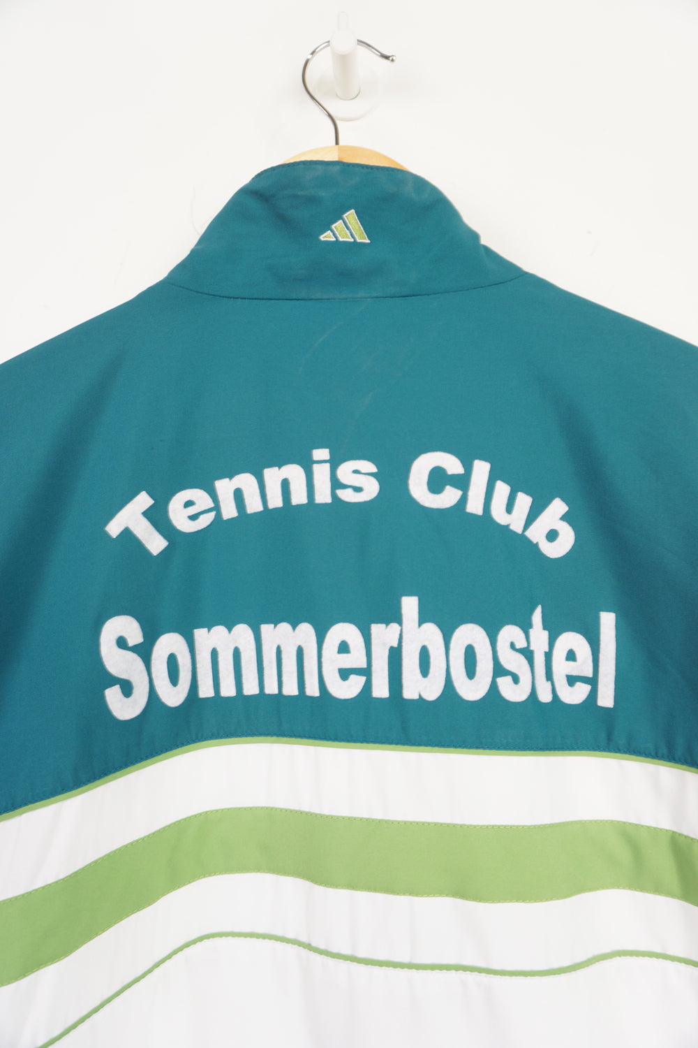 90's Teal Adidas zip through tracksuit top with green details and embroidered logo on the chest. "Tennis Club Sommerbostel" raised lettering on&nbsp;reverse good condition: slight discolouration on lettering Size in Label: L 