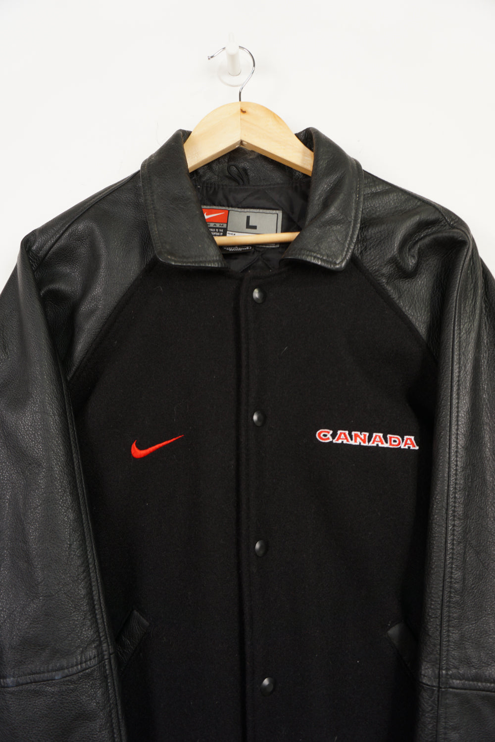 Team Canada x Nike black wool bomber jacket with leather sleeves and embroidered logos 