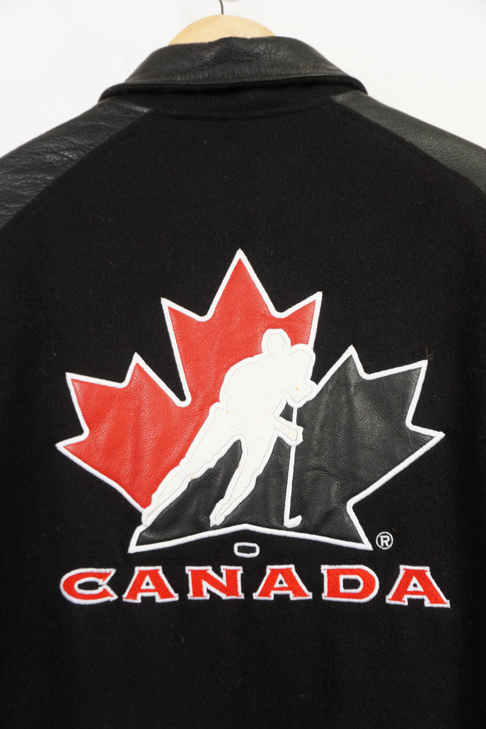 Team Canada x Nike black wool bomber jacket with leather sleeves and embroidered logos 