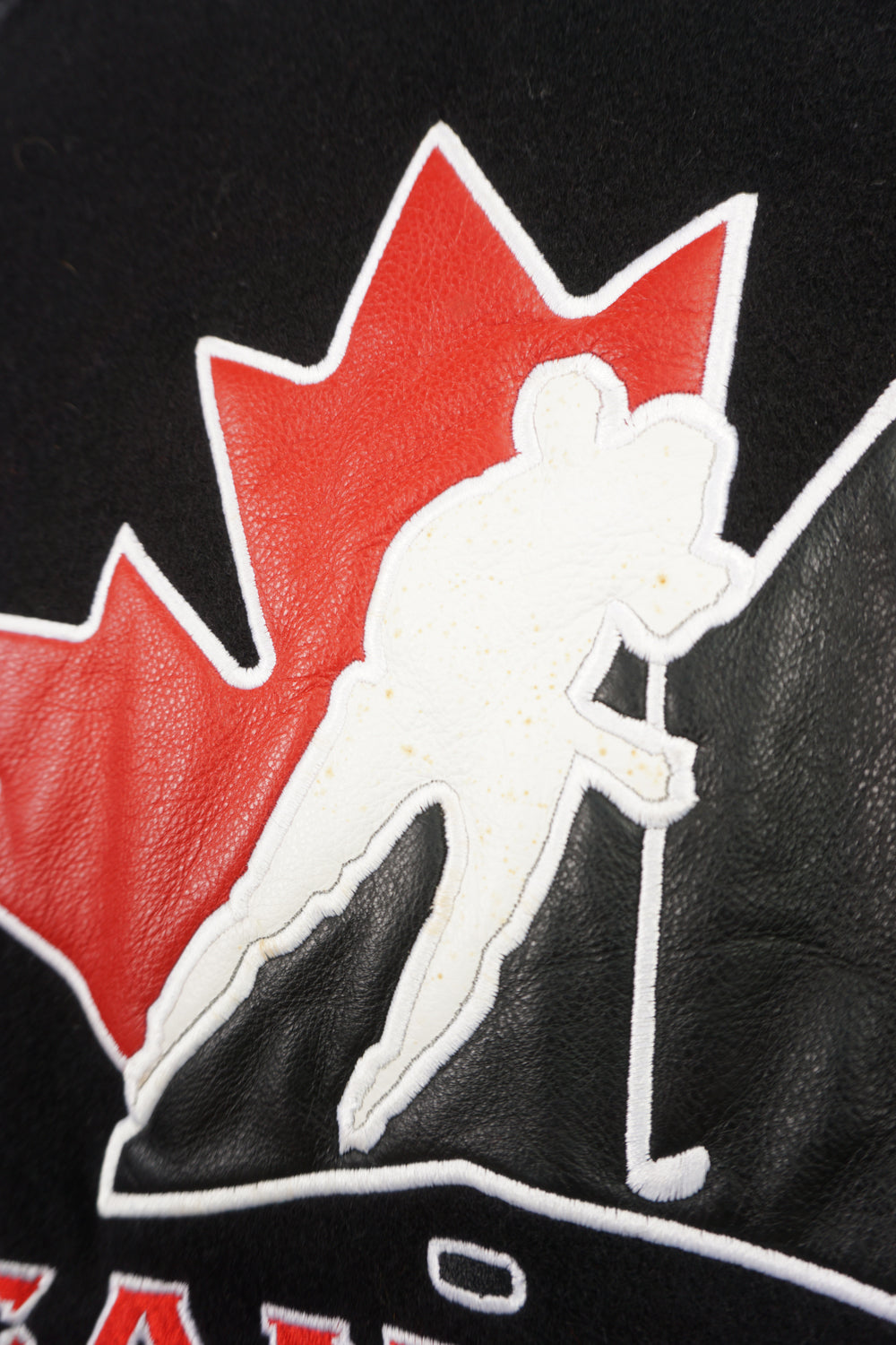 Team Canada x Nike black wool bomber jacket with leather sleeves and embroidered logos 