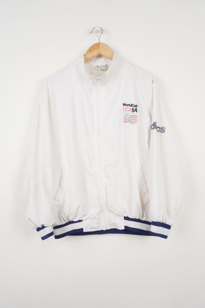 World Cup USA 94 Tracksuit Top by adidas in white with embroidered spell-out and graphic on front back and sleeve