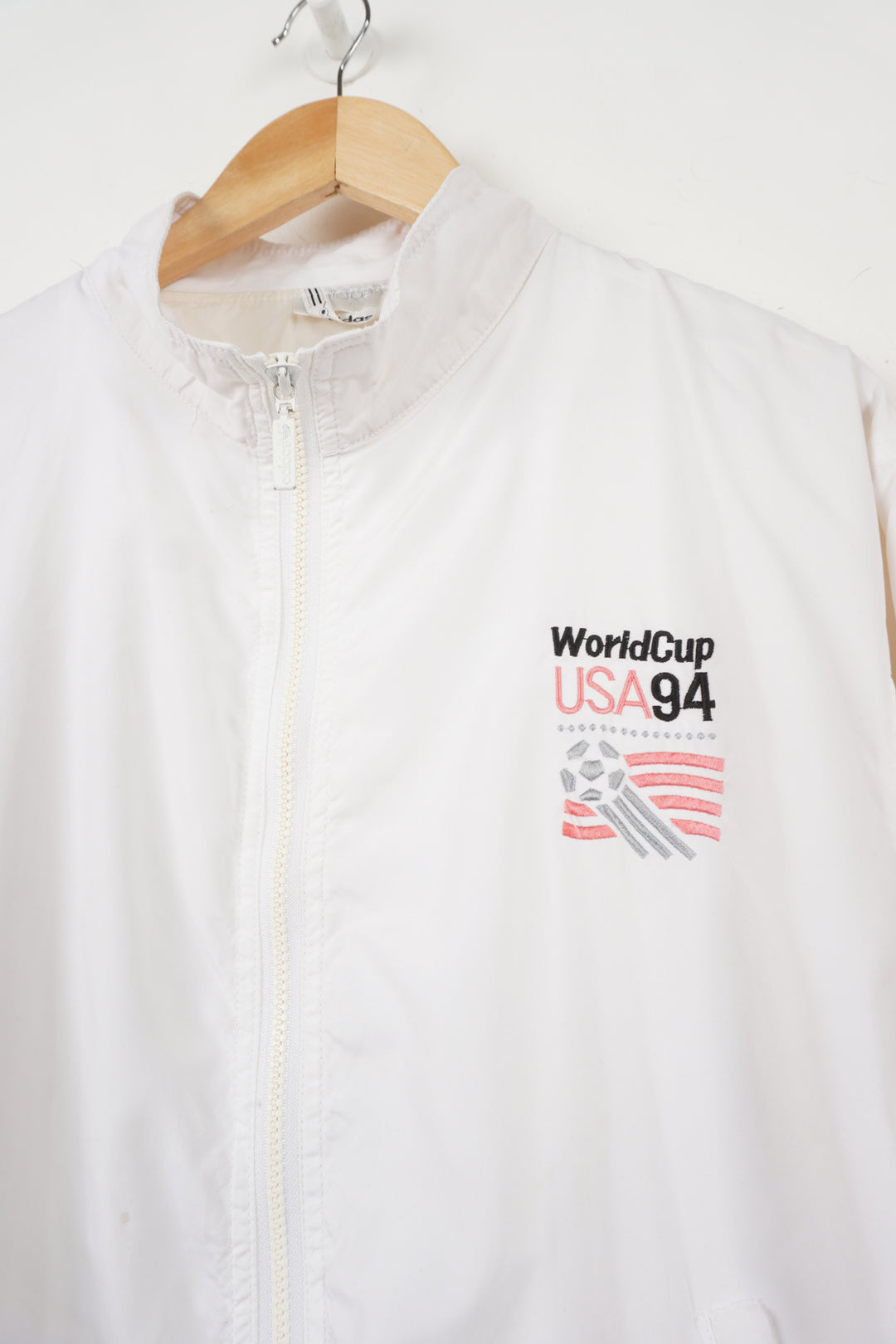 World Cup USA 94 Tracksuit Top by adidas in white with embroidered spell-out and graphic on front back and sleeve