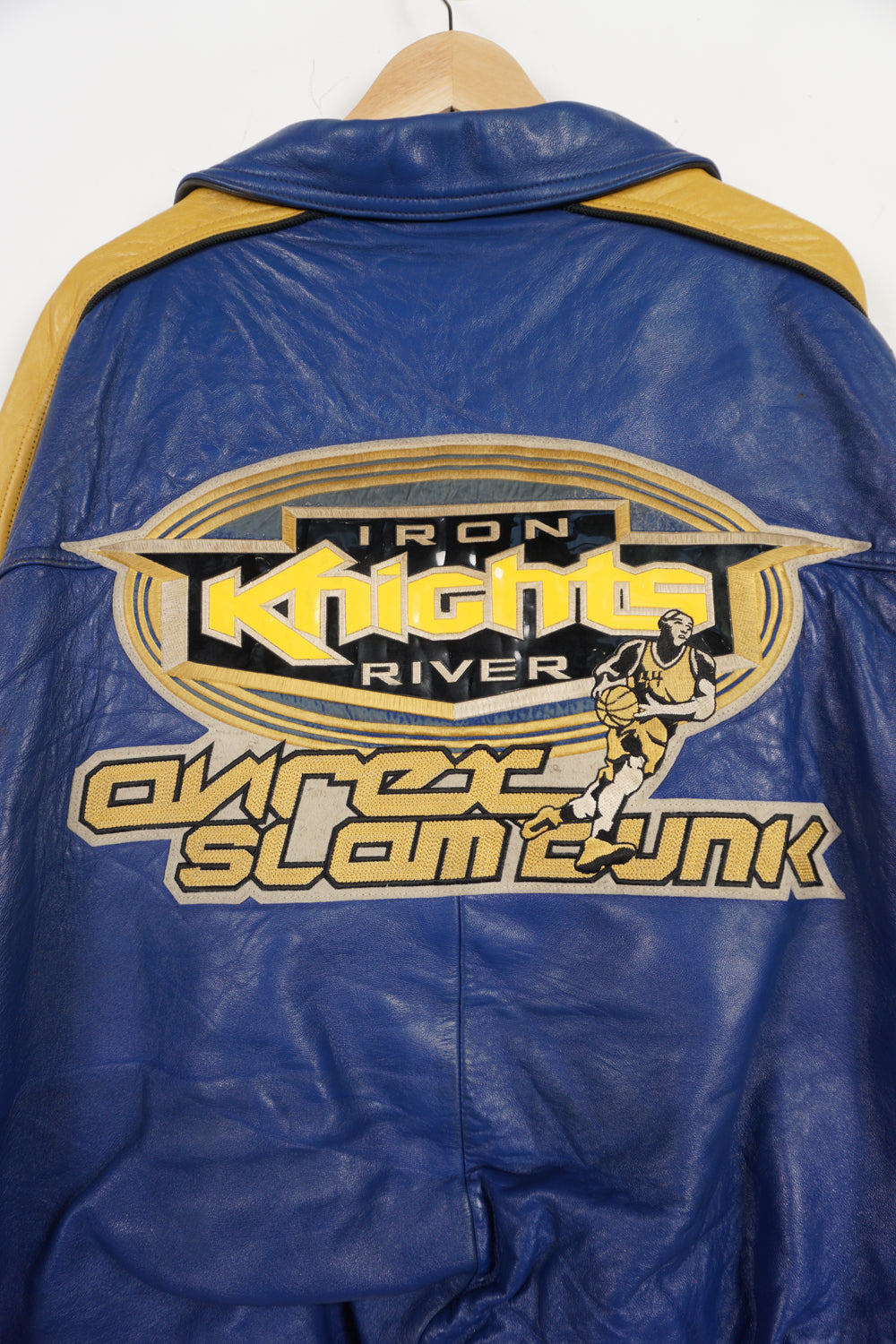 Vintage Avirex USA Slam Dunk 05 blue and yellow leather varsity jacket with embroidered patches on the front and back 