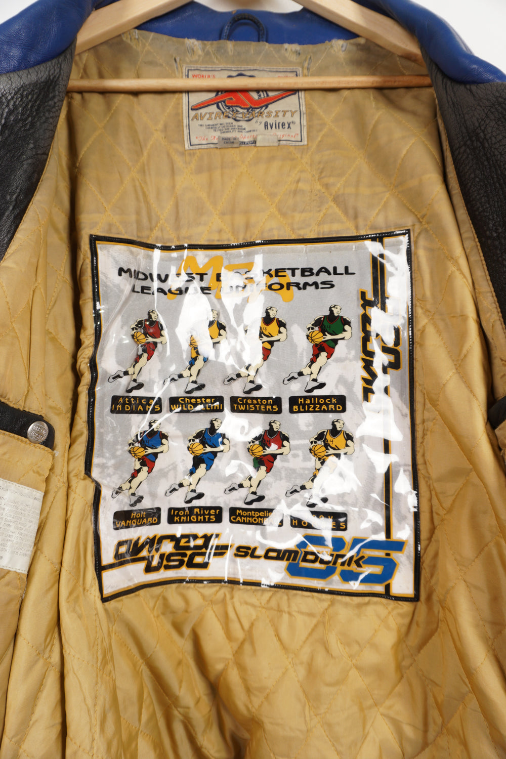 Vintage Avirex USA Slam Dunk 05 blue and yellow leather varsity jacket with embroidered patches on the front and back 