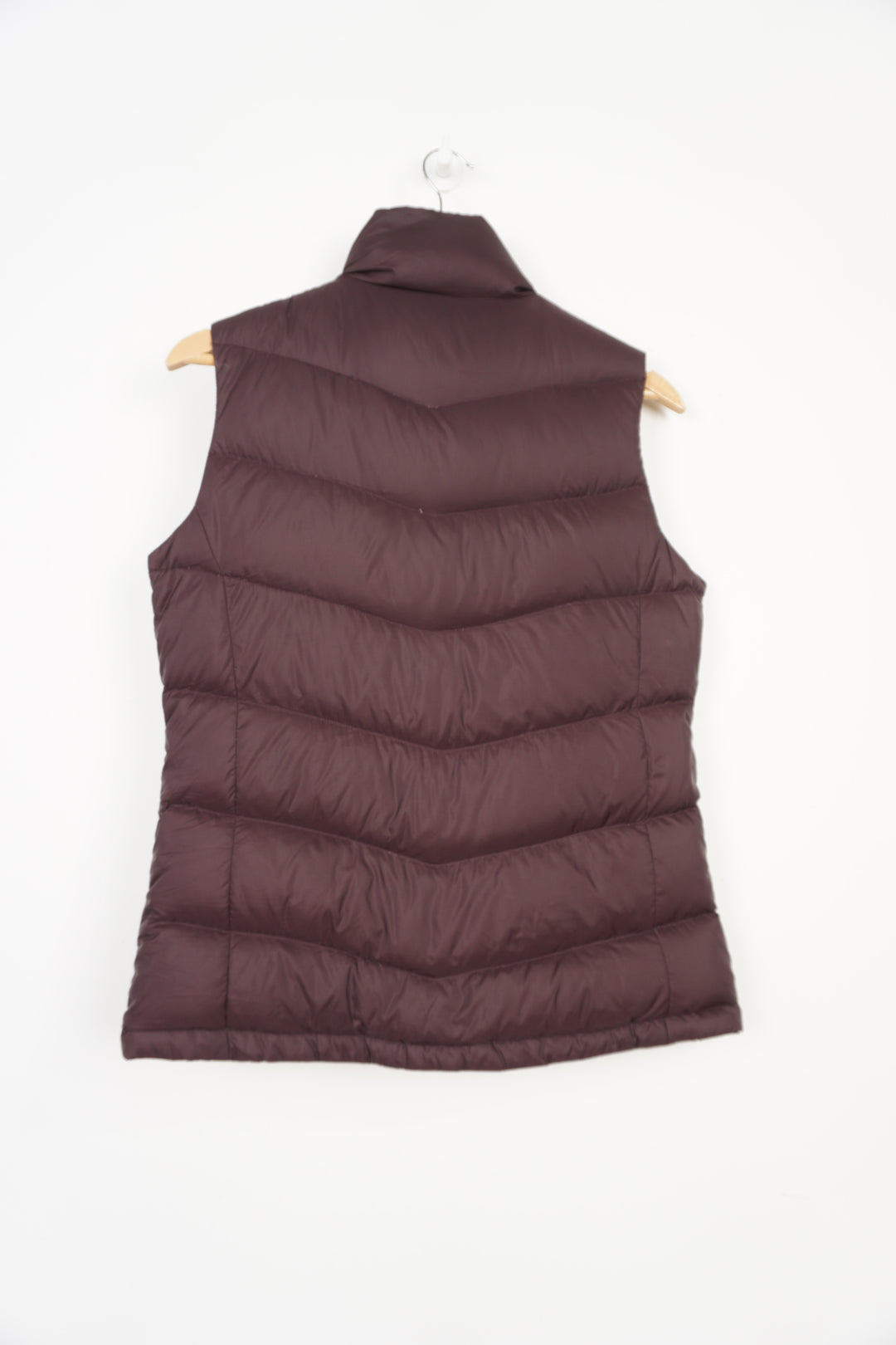 The North Face 700 purple zip through gilet with embroidered logo on the chest