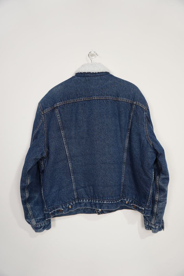 Vintage 90s Levi Strauss button up Sherpa Trucker dark blue denim jacket with red tab