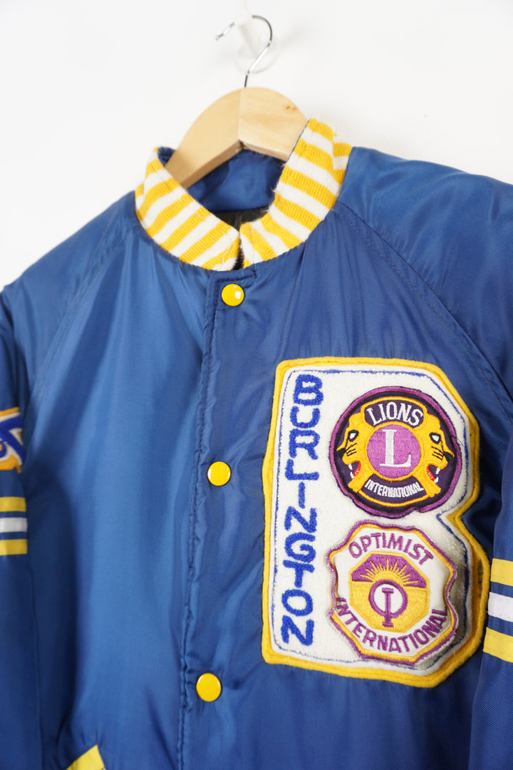 Vintage 1970s/80s blue bomber jacket with embroidered Burlington badges and quilted lining