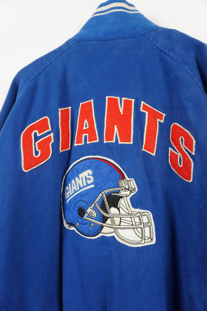 Vintage 1995 New York Giants cotton bomber Jacket. Embroidered name on front and logo on back. Fair Condition, signs of wear due to age, discolouring on team name and dark mark near front pockets (see pictures) Size in Label: L 