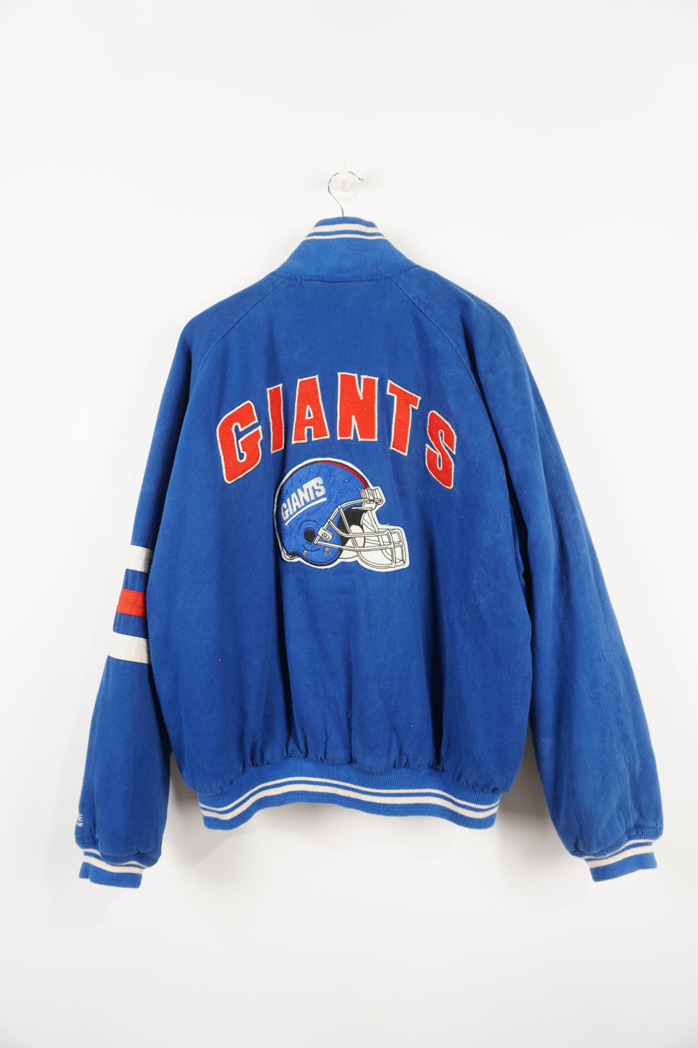 Vintage 1995 New York Giants cotton bomber Jacket. Embroidered name on front and logo on back. Fair Condition, signs of wear due to age, discolouring on team name and dark mark near front pockets (see pictures) Size in Label: L 