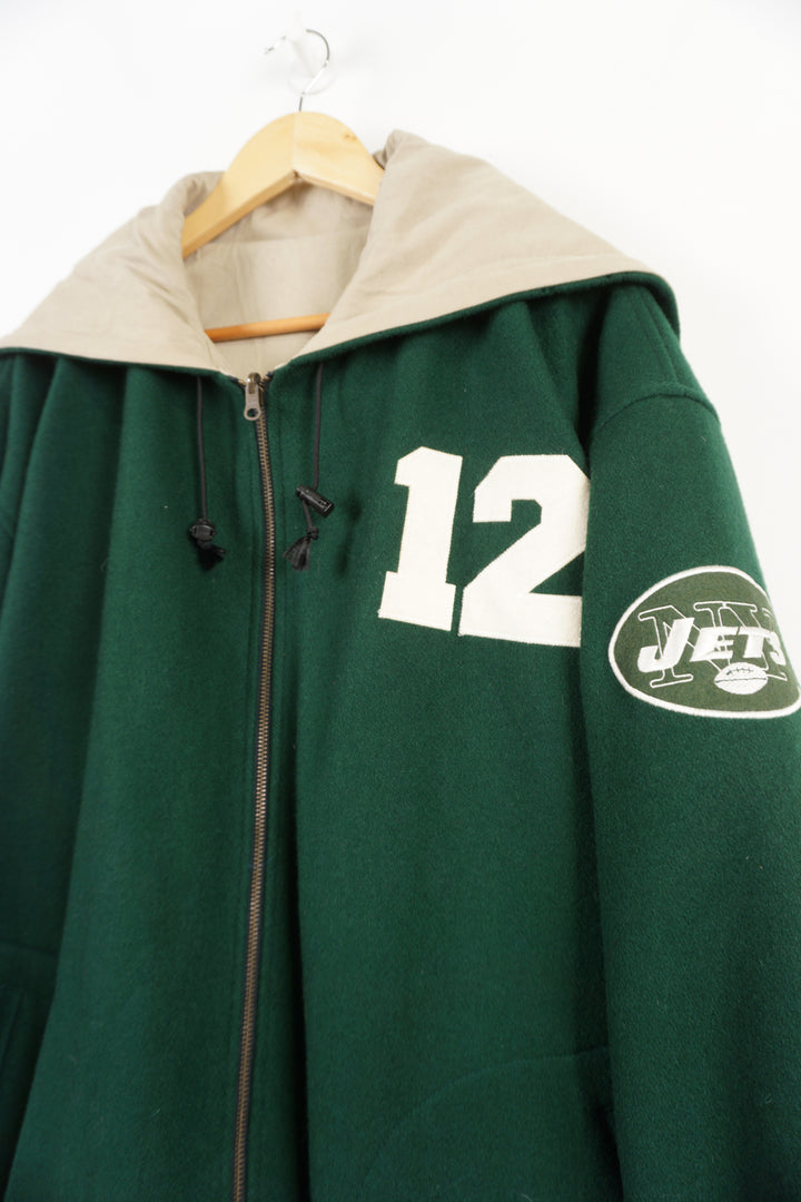 Vintage 90's New York Jets green hooded varsity jacket, reversible. Embroidered logo and name on front, back and sleeve. Good Condition, 2 small holes on back of right sleeve (see pictures) Size in Label: XL