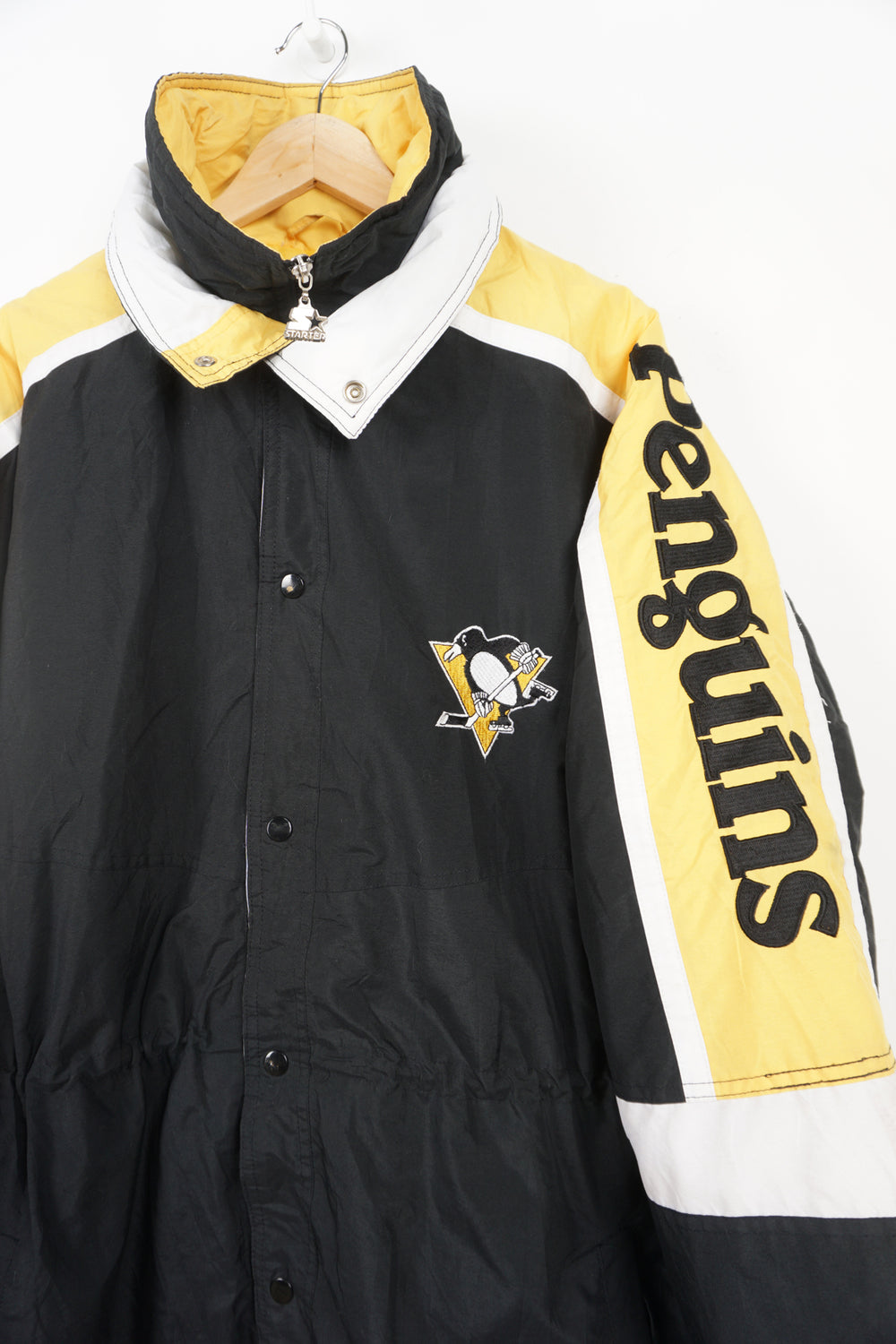 Vintage 90's Pittsburgh Penguins bench coat with embroidered details on the sleeves and chest