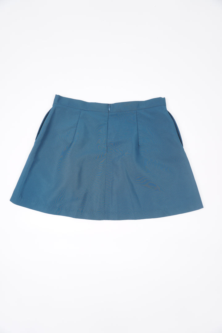 Teal blue Nike pleated tennis skirt with embroidered logo near the hem and zip closure