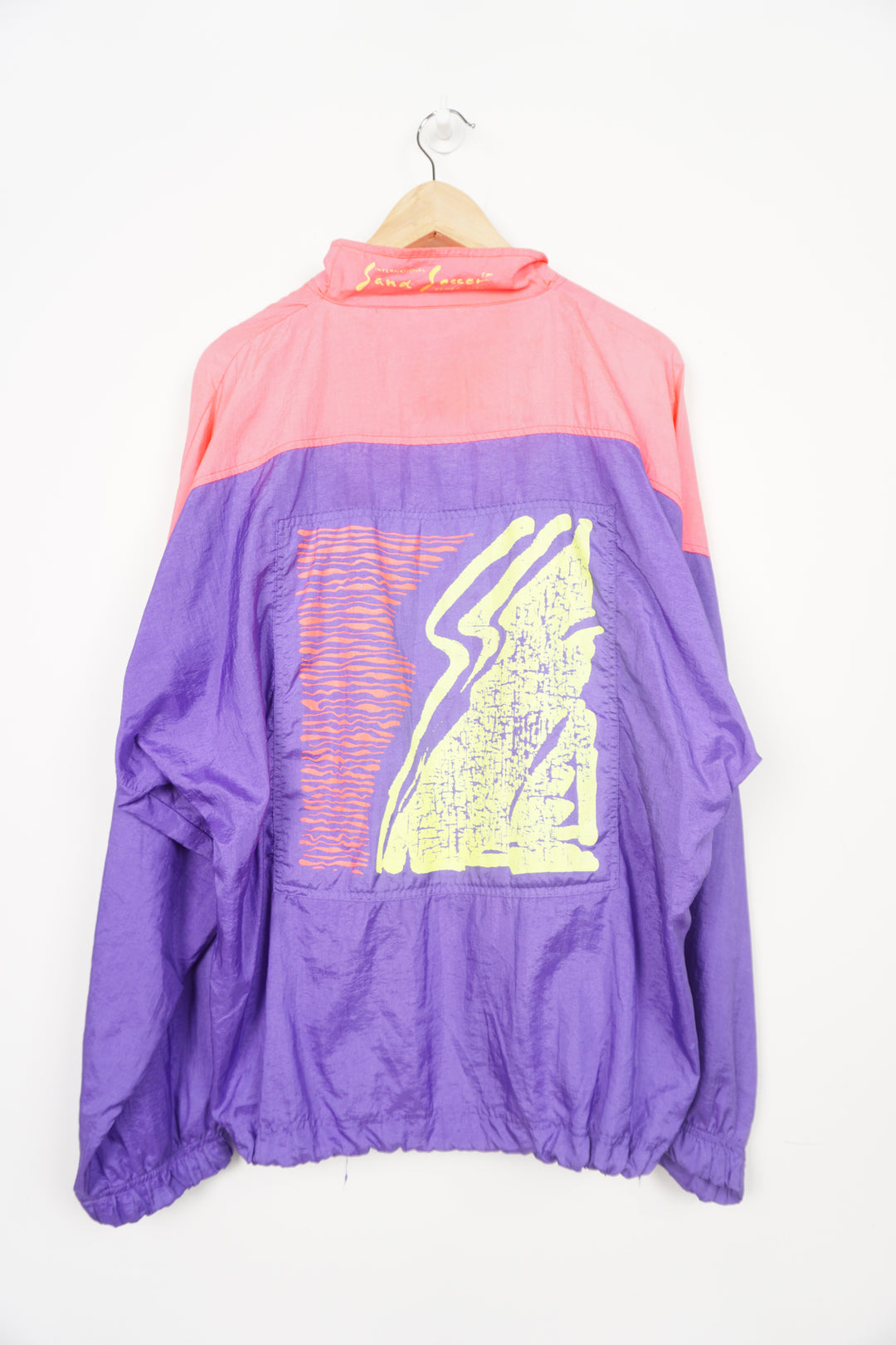 Vintage 90s Umbro Sand Soccer pink and purple 1/4 zip pullover jacket with embroidered logo on the chest and printed logo on the back