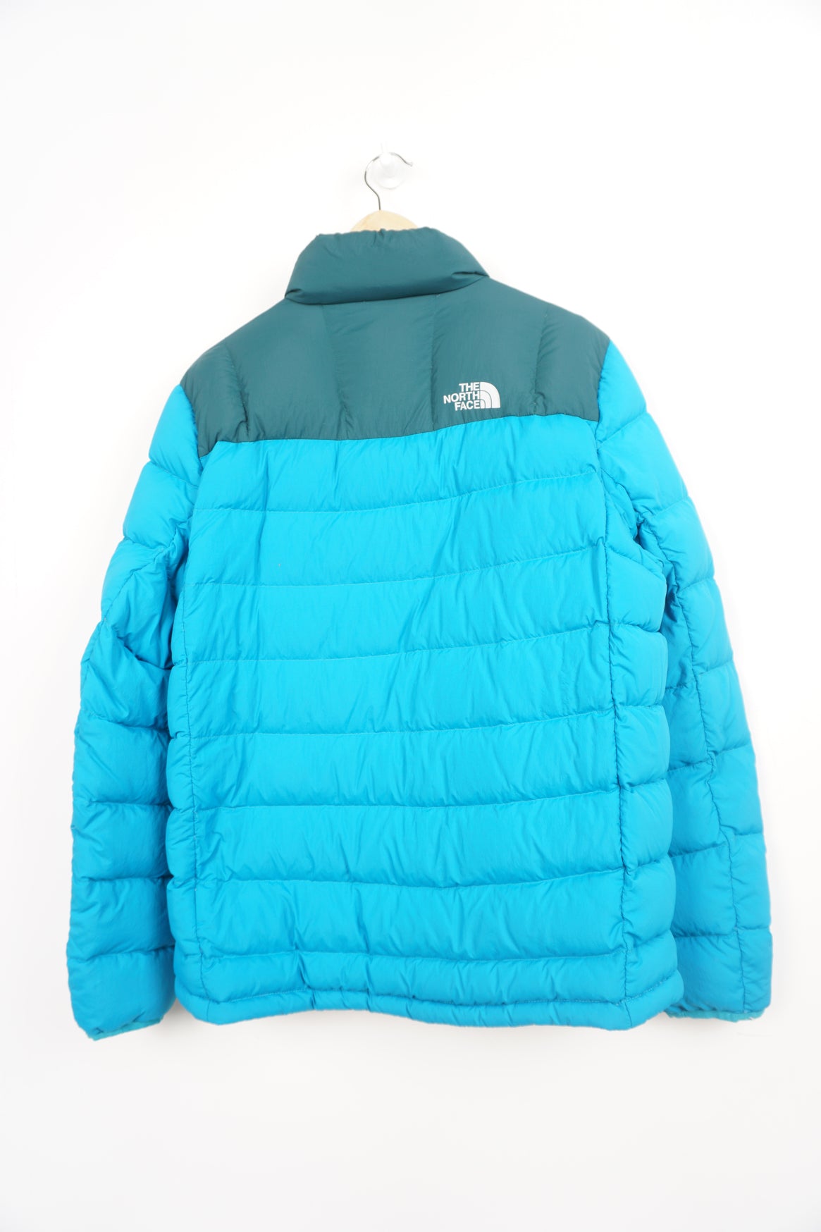 Two tone blue The North Face 600 puffer jacket with drawstring hem and multiple pockets