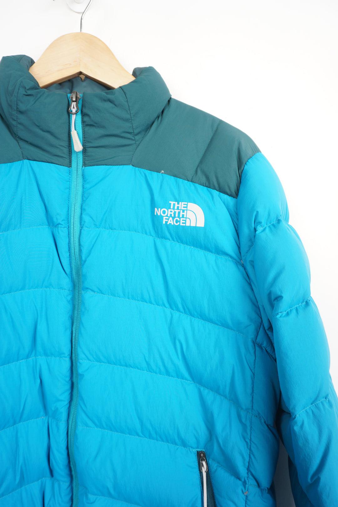 Two tone blue The North Face 600 puffer jacket with drawstring hem and multiple pockets