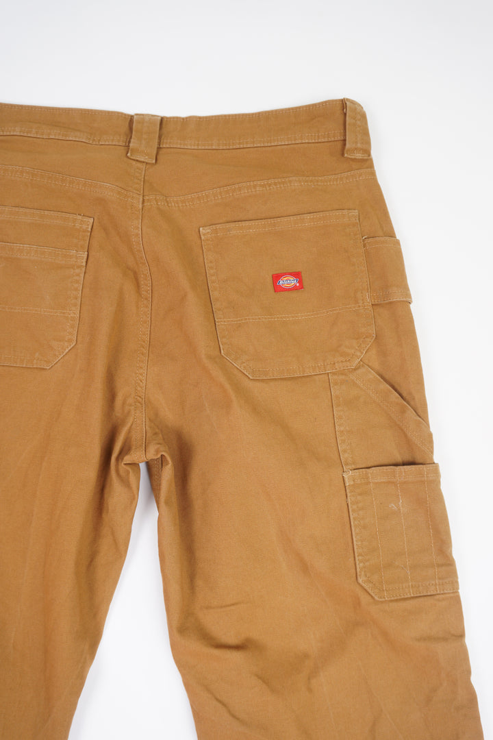 Dickies tan carpenter style jeans with multiple pockets and double knee