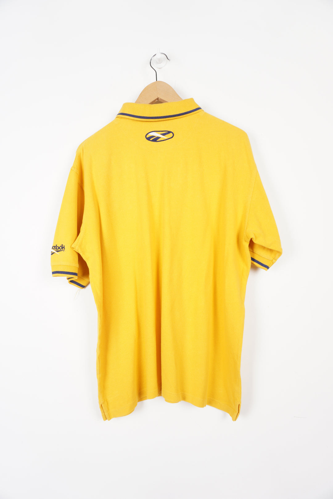 90's Reebok all yellow polo shirt with embroidered logo on the chest