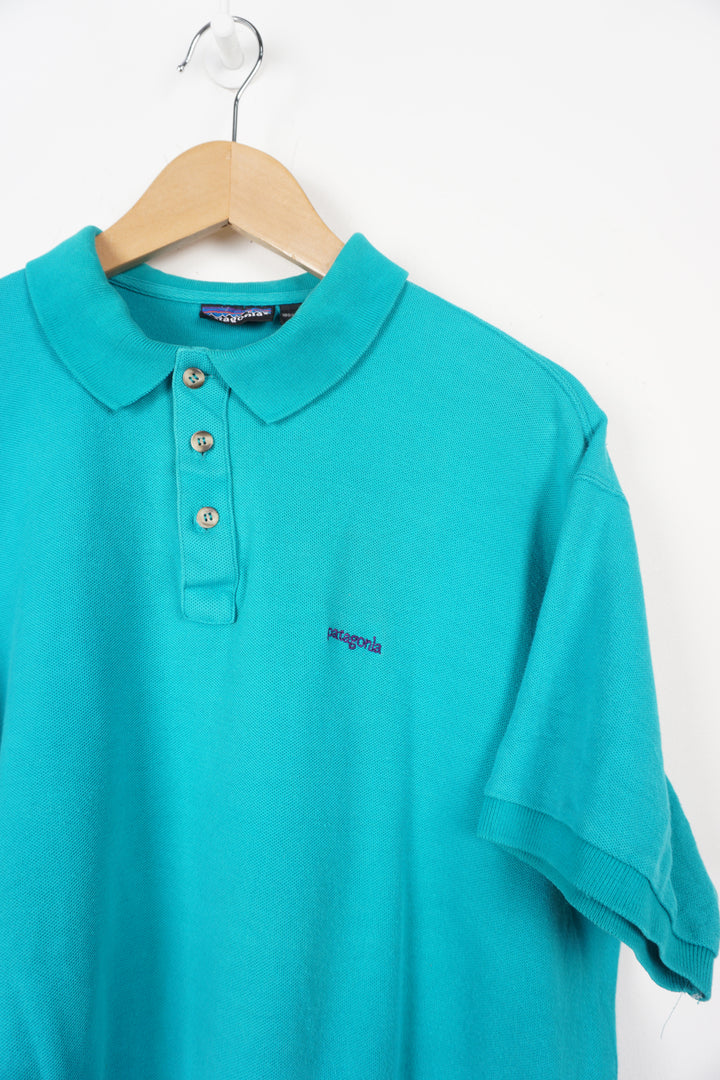 Patagonia teal blue polo shirt with embroidered logo on the chest