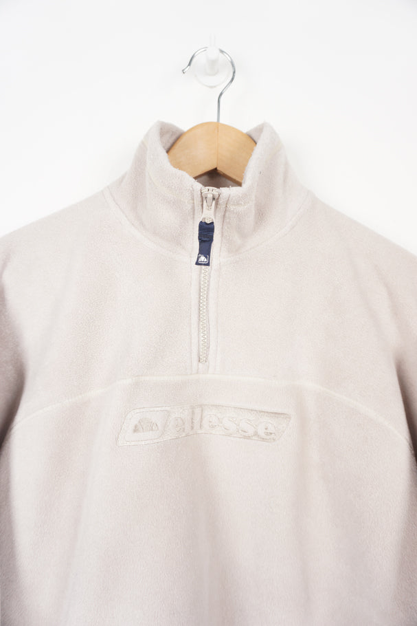 Cream Ellesse 1/4 zip fleece with embroidered logo on the chest