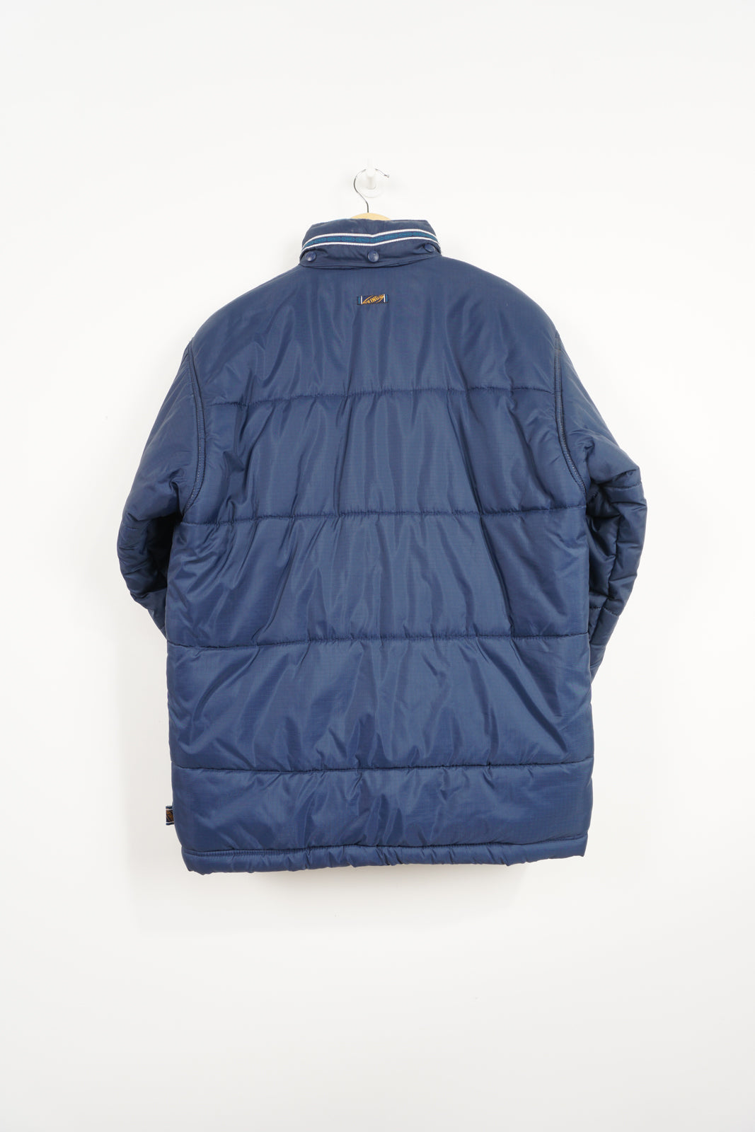 Navy blue Puma King Puffer coat with embroidered logo on the chest and foldaway hood 