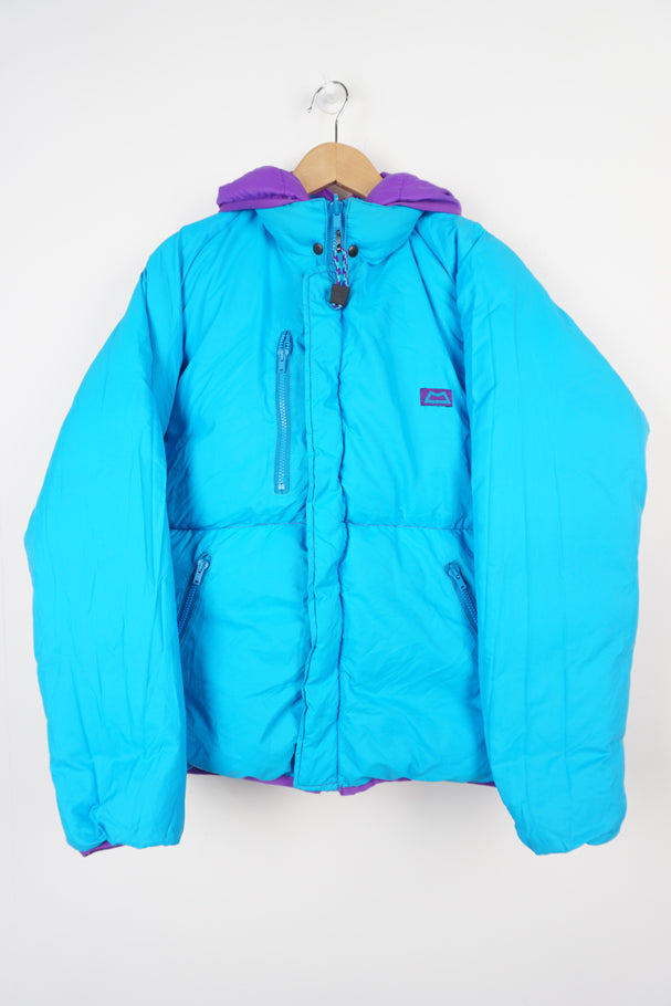 Mountain Equipment light line purple and blue reversible puffer jacket with and logo on front