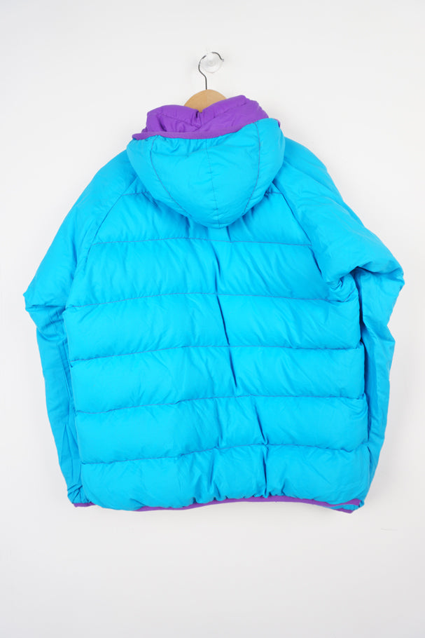 Mountain Equipment light line purple and blue reversible puffer jacket with and logo on front